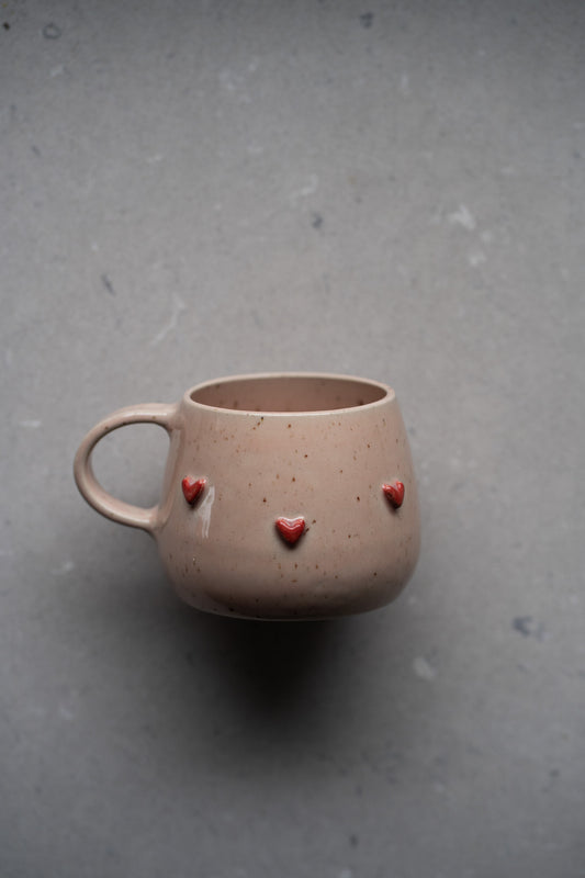 Valentinova skodelica sijoča nežno roza